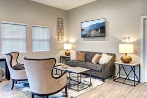 Kent apartment for rent - A living room with a couch, two chairs, and a coffee table.