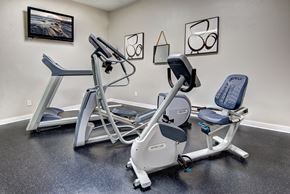 Kent apartment for rent - A gym room with a rowing machine and a stationary bike.
