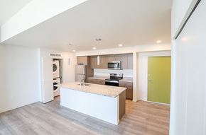 Federal Way apartment for rent - A kitchen with a white island in the middle of the room.