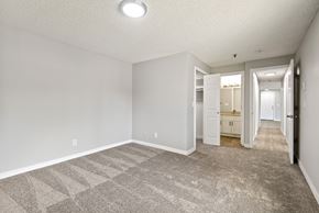 Kent apartment for rent - A spacious room with a carpeted floor and white walls.