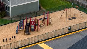 Auburn apartment for rent - A playground with a slide, swings, and a sandbox.