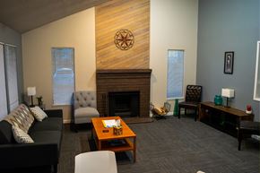 Des Moines apartment for rent - A living room with a fireplace and a couch.