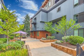 Redmond apartment for rent - A building with a purple umbrella in front of it.