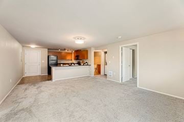 Bellevue apartment for rent - A living room with a television and a bar area.