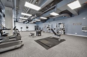 Tukwila apartment for rent - A gym with treadmills, weights, and exercise equipment.