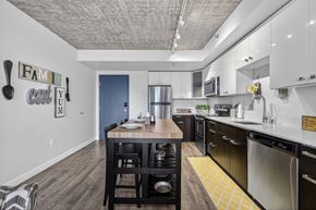 Tukwila apartment for rent - A kitchen with a dining table and chairs.