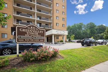 Kitchener apartment for rent - A sign for the Green Valley Towel is in front of a building.