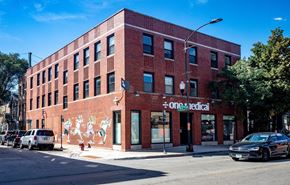 Chicago apartment for rent - a red brick building on the corner of a city street