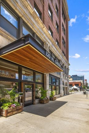 Chicago apartment for rent - a view of the front of a building on a sidewalk