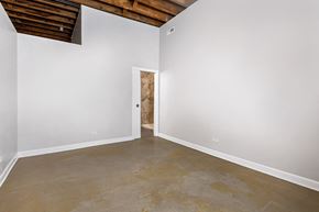 Chicago apartment for rent - an empty room with white walls and a cement floor