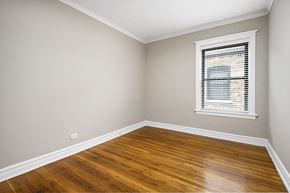 Chicago apartment for rent - an empty room with wood floors and a window