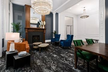 Chicago apartment for rent - a living room with a fireplace and a table and chairs