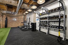 Chicago apartment for rent - a gym with weights and a weights rack