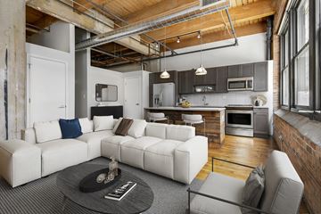 Chicago apartment for rent - a living room with a white couch and a table