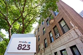 Chicago apartment for rent - a sign that reads reside at 823 in front of a building