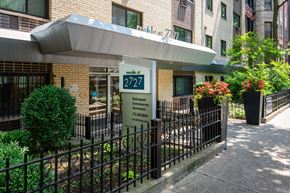Chicago apartment for rent - Outside of the building of Reside at 2727 showing sign and fence