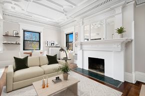 Chicago apartment for rent - A living room with a fireplace and a couch.