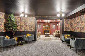 Chicago apartment for rent - A room with grey chairs and a grey carpet.