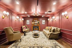 Chicago apartment for rent - A living room with a sofa, chairs, and a rug.