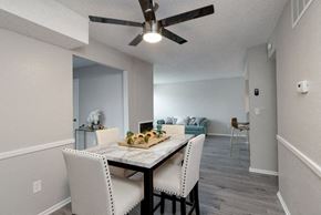 Wichita apartment for rent - A dining room with a table set for two.