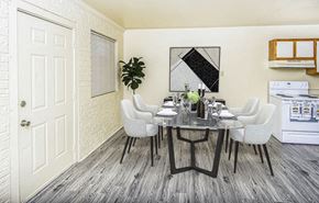 Baton Rouge apartment for rent - A dining room with a white table and chairs.