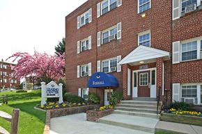Silver Spring apartment for rent - A brick building with a blue awning and a sign that says Foghall.