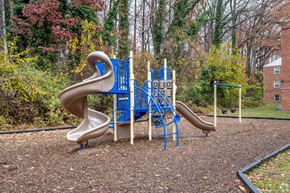 Silver Spring apartment for rent - A playground with a blue and brown slide.