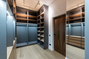 Austin apartment for rent - A room with a wooden floor and a brown door.