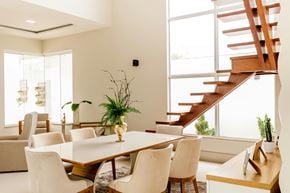 San Francisco apartment for rent - A dining room with a wooden table and white chairs.