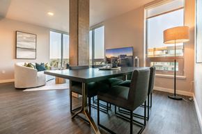 Bellevue apartment for rent - A modern dining room with a large table and chairs.