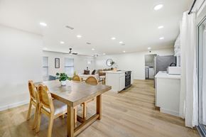 Merritt Island apartment for rent - A modern kitchen with a dining table and chairs.