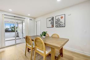 Merritt Island apartment for rent - A dining room with a wooden table and chairs.