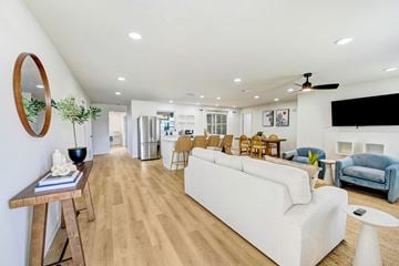 Merritt Island apartment for rent - A living room with a white couch and wooden floors.