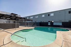 El Cajon apartment for rent - A small pool with a metal fence around it.