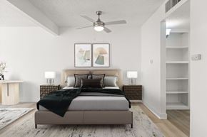 El Cajon apartment for rent - A bedroom with a large bed and a ceiling fan.