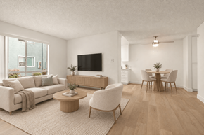 El Cajon apartment for rent - A living room with a couch, chairs, and a television.