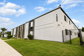 El Cajon apartment for rent - A large white building with the number 1050 on the side.