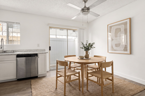 San Diego apartment for rent - A dining room with a table set for two and a plant on the table.