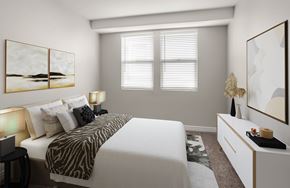 North Hollywood apartment for rent - A bedroom with a zebra print bedspread and a white bed.