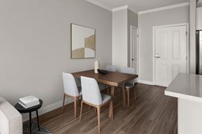 North Hollywood apartment for rent - A dining room with a wooden table and chairs.
