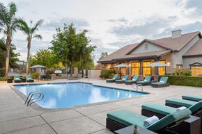 Modesto apartment for rent - A large house with a pool in the backyard.