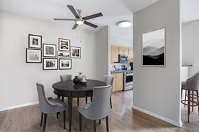 Modesto apartment for rent - A dining room with a table and chairs and pictures on the wall.