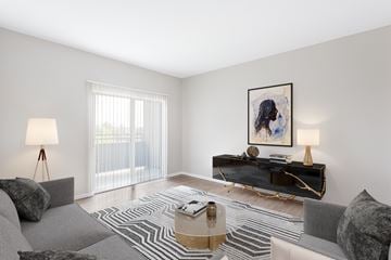 Modesto apartment for rent - A living room with a grey couch, a coffee table, and a painting on the wall.