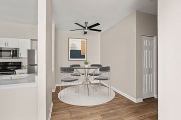 Olympia apartment for rent - A dining area with a table and chairs is shown.