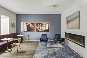 Las Vegas apartment for rent - A living room with a fireplace and a painting on the wall.