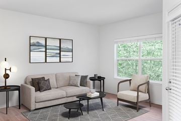 Gresham apartment for rent - A living room with a couch, chair, and a table with a lamp on it.