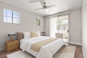 Glendale apartment for rent - A bedroom with a large bed and a ceiling fan.