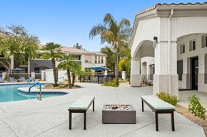 Glendale apartment for rent - A poolside area with a fire pit and seating.