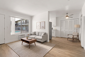 El Cajon apartment for rent - A living room with a couch, a coffee table, and a chair.
