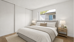El Cajon apartment for rent - A bedroom with a large bed and a window.
